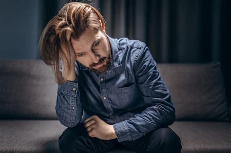 Premium Photo Mature Man Sitting On Couch And Feeling Depressed