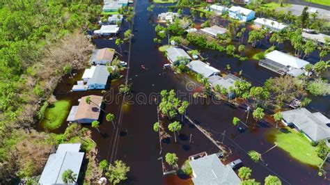 Kayak Boat Floating On Flooded Street Surrounded By Hurricane Ian