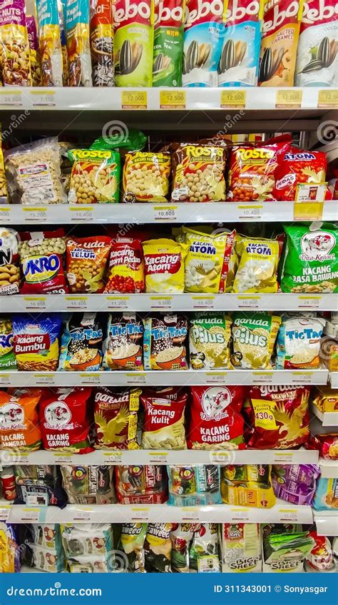 Packaged Snacks are Sold on Shelves in a Supermarket. Editorial Photo ...