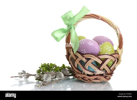 Basket With Easter Eggs And Pussy Willow Twigs Isolated On White Stock Photo Alamy