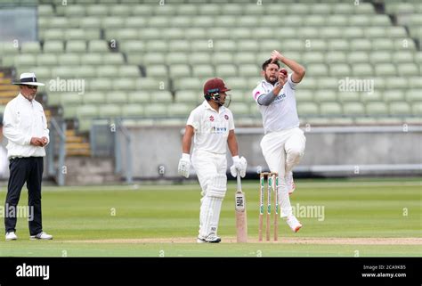 Warwickshire's Tim Bresnan bowling and watched by Northamptonshire's ...