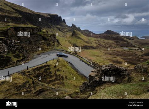Car Negotiating Hairpin Bend On The Single Track Road At The Top Of The