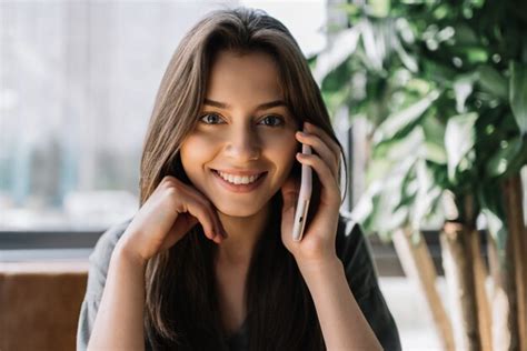 Premium Photo Beautiful Smiling Woman Talking On Mobile Phone