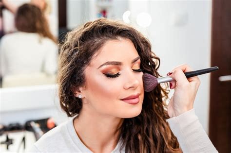 Premium Photo Make Up Artist Applying Professional Make Up To