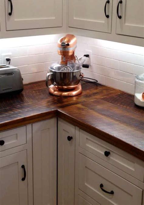 A Kitchen Counter Top With A Mixer And Toaster On It