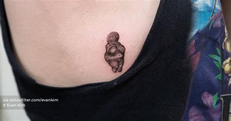 Venus Of Willendorf Tattoo Located On The Side Boob