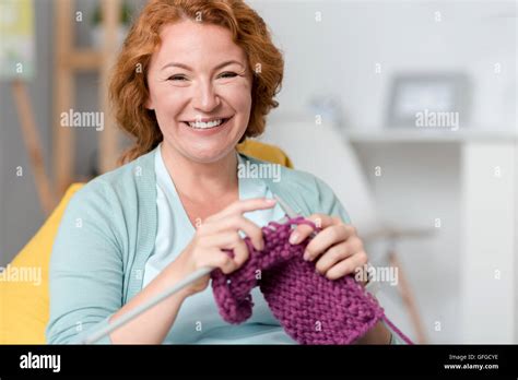 Cheerful Smiling Woman Knitting Stock Photo Alamy