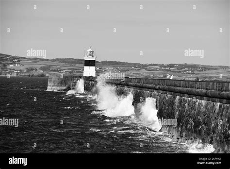 Waves Crashing Into Harbour Wall Black And White Stock Photos And Images