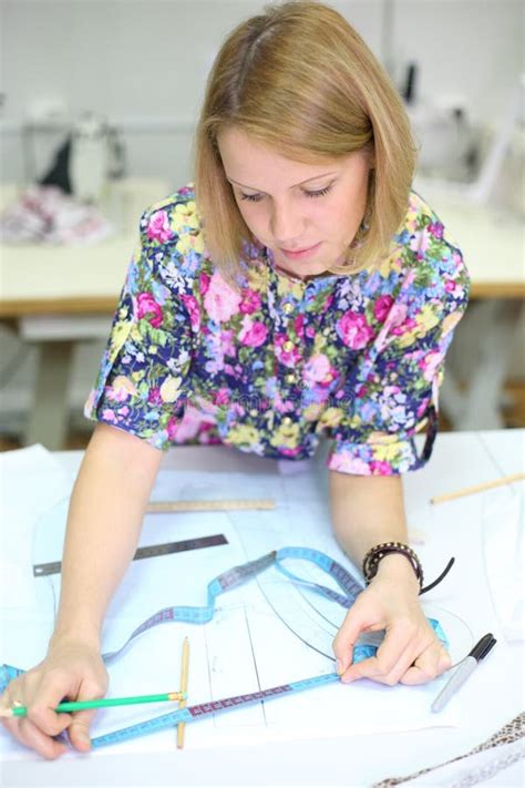 Female Tailor With Pencil And Tape Draws Patterns Stock Image Image