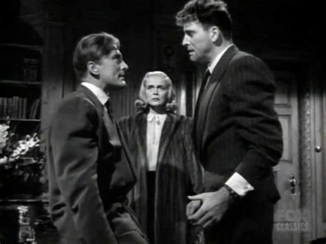 Three Men In Suits Talking To Each Other On The Set Of An Old Tv Show