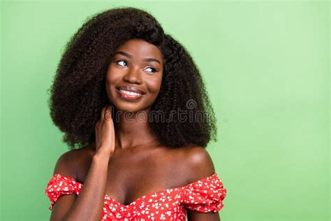 Photo Of Cute Millennial Curly Hairdo Brunette Lady Look Empty Space Wear Red Top On Green Color