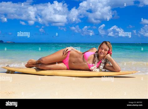 Teenage Girl In Pink Bikini At The Beach In Hawaii Lounging On Her