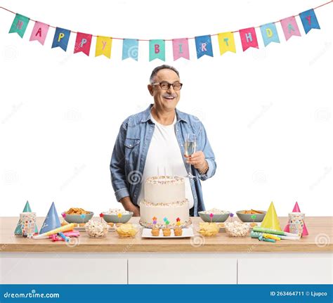 Cheerful Mature Man With A Glass Of Champagne Celebrating Birthday