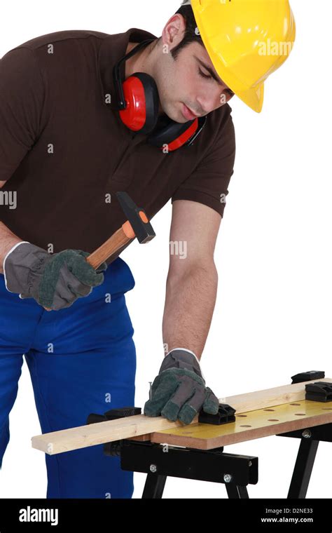 Worker Using A Hammer Stock Photo Alamy