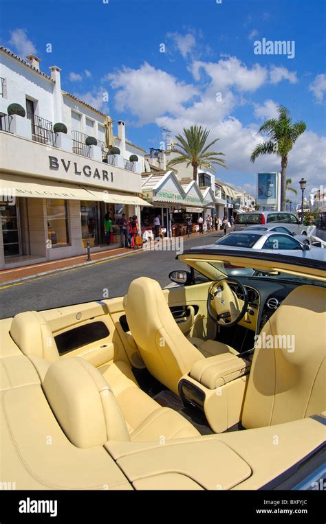 Luxury Car And Shops At The Exclusive Yacht Harbour Of Puerto Ban S