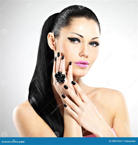 Face Of The Beautiful Woman With Black Nails And Pink Lips Stock Image