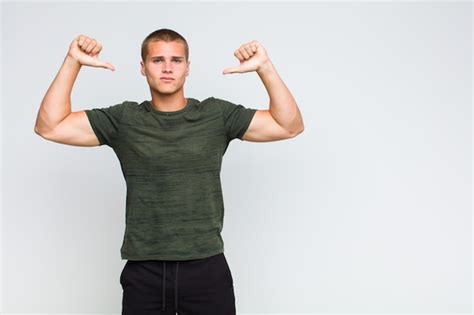 Premium Photo Blonde Man Feeling Proud Arrogant And Confident Looking Satisfied And