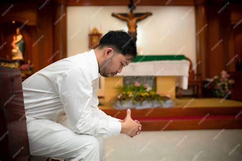 Premium Photo Christian Man Asking For Blessings From Godasian Man