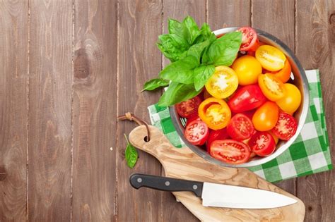 Premium Photo Fresh Colorful Tomatoes And Basil In Colander