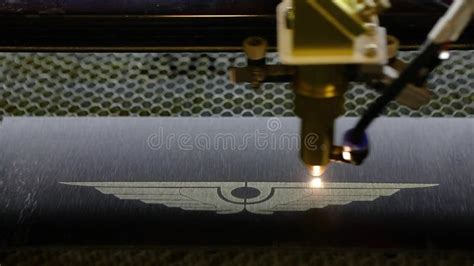 Logo Engraving with a Laser on a Metal Plate. Close-up CNC Engraving ...