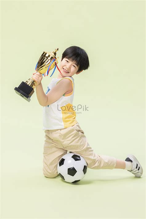 Little Boy Playing Football Awards Gold Medal Picture And HD Photos ...