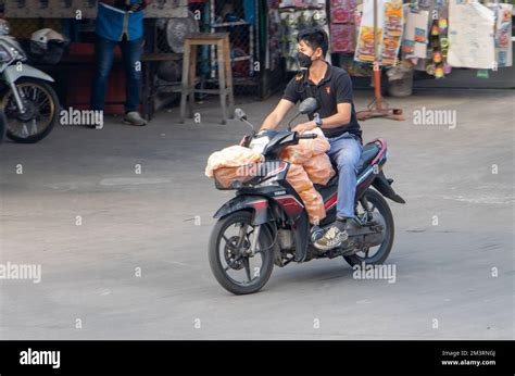 Samut Prakan Thailand October A Man Rides A Motorbike With