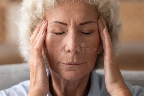 Mature Old Lady Suffer From Migraine At Home Stock Photo Image Of