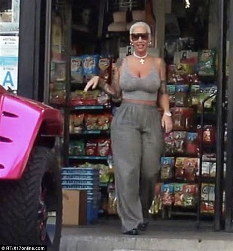 Amber Rose Stops Traffic In Booty Hugging Trousers While Hoppng Into