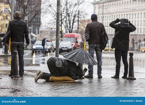 Homeless Beggar Sleeping At Leicester Square In London Editorial Image