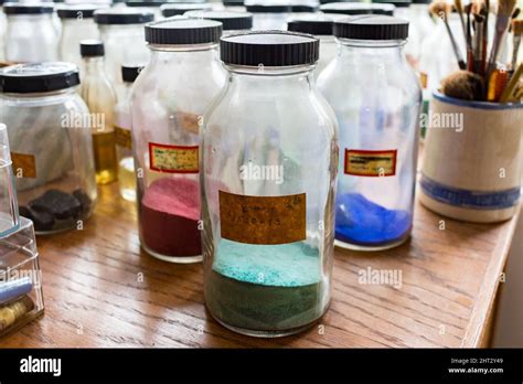 Old Glass Jars Full Of Paint Colors In Background There Are Paint