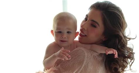 A Beautiful Mother Holds A Small Naked Stock Video Pond