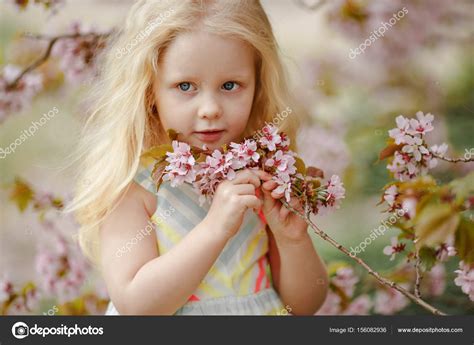 A Cute Charming Blonde Girl With Lush Hair Smiling On A Pink Sak Stock Photo Coy Creek