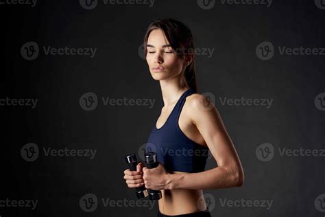 Pretty Brunette With Dumbbells In Her Hands Slim Figure Gym Fitness