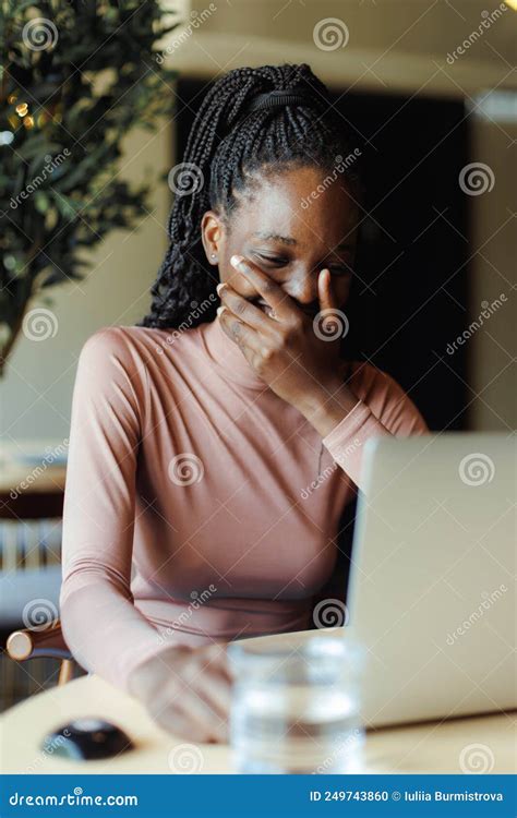 Young Afro American Woman Laughing Covering Mouth And Talking Online On