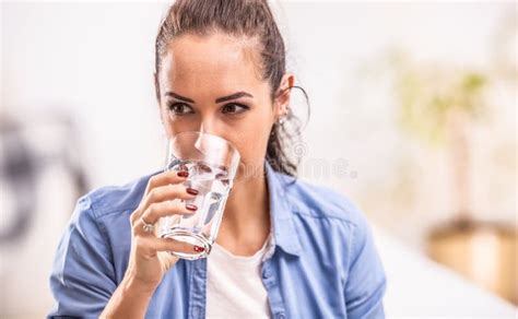 Woman Drinks Pure Water From A Glass In Her Hand Stock Image Image Of