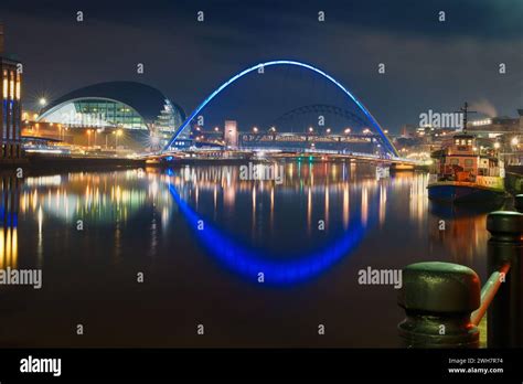 Newcastle Quayside And Tyne Bridges At Night With Light Reflections In