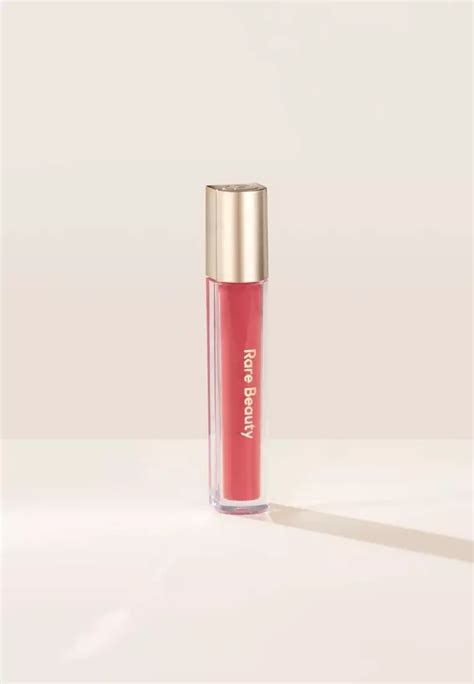 Buy Rare Beauty Stay Vulnerable Glossy Lip Balm In Nearly Apricot 2024