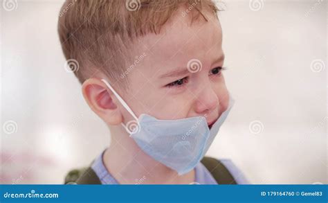 Portrait Of A Cute Little Boy A Child In A Mask From Viruses Of The