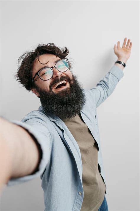 Bearded Man Taking A Fun Selfie With Joyful Expression Stock Photo