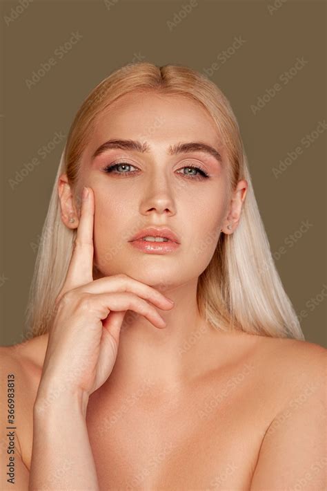 Beauty Portrait Aesthetic Cosmetology Blonde Nude Woman With Natural Makeup Touching Face Skin