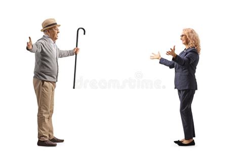 Full Length Profile Shot Of An Elderly Gentleman Meeting A Mature Woman