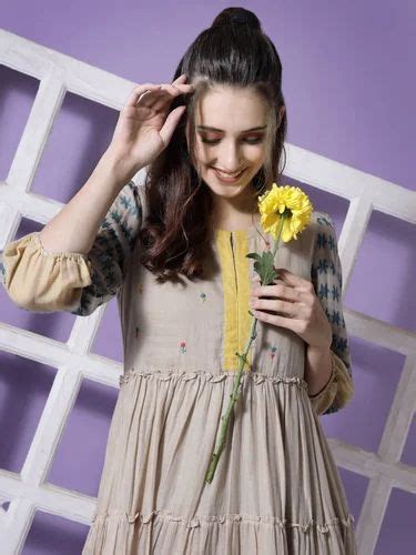 Terquois Beige Woven A Line Dress With Ruffle Detail And Has A Round