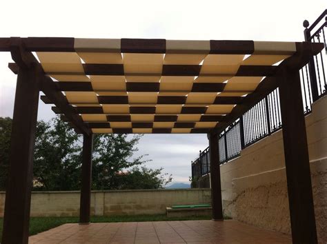 An Outdoor Area With Tiled Floor And Pergolated Roof