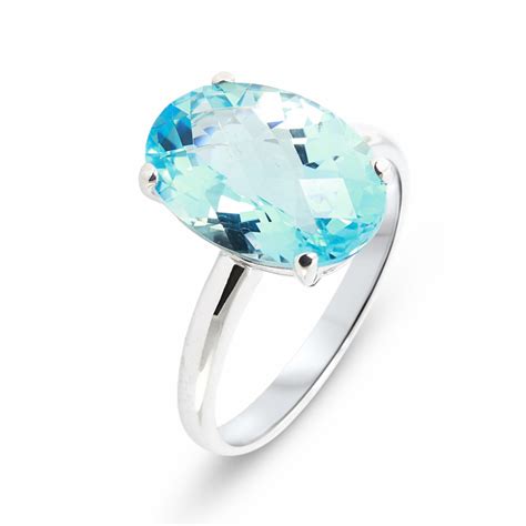 Bague Or Blanc Topaze Bleue Ovale X Mm Ref