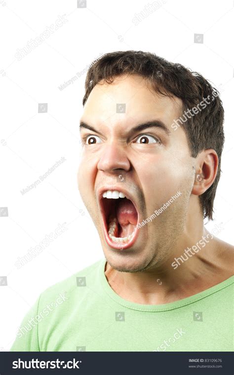 Portrait Of Young Angry Man Screaming Isolated On White Background