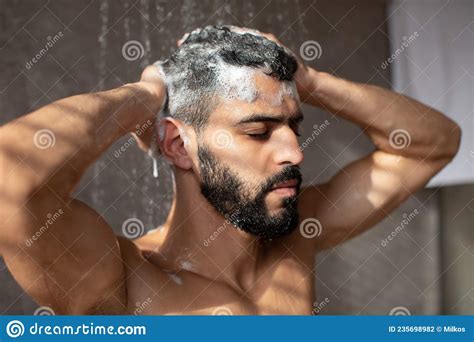 Handsome Condifent Young Arabic Male Model Enjoying Taking Hot Shower