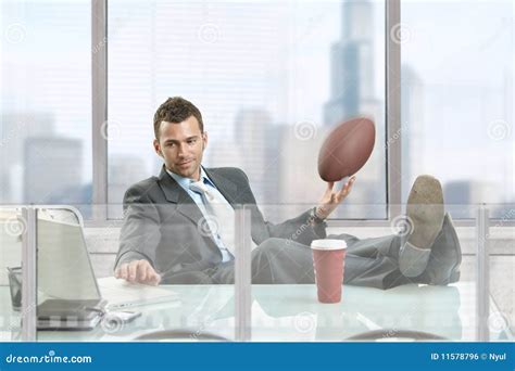 Businessman with football stock photo. Image of male - 11578796