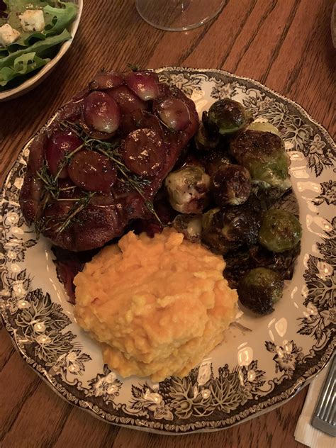 Pan Seared Duck Breast With A Port Wine Sauce Mashed Sweet Potatoes And Oven Roasted Brussel