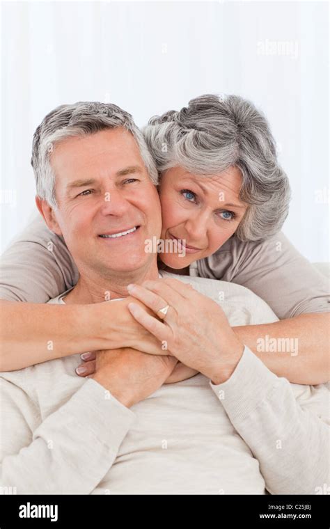 Mature Woman Hugging Her Husband Stock Photo Alamy
