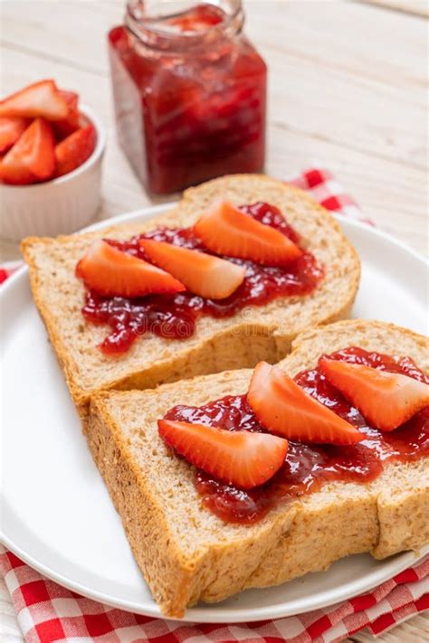 Whole Wheat Bread With Strawberry Jam And Fresh Strawberry Stock Photo